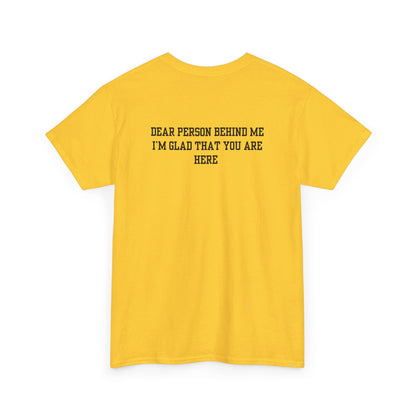A folded daisy t-shirt with a smiling sunflower and the words “Make the best out of Everyday” on the front and “Dear Person behind me, I’m glad that you are here” on the back.