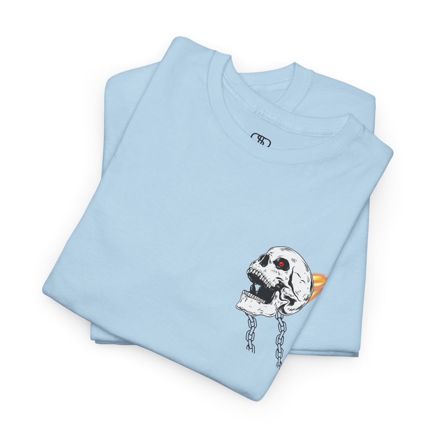 A folded light blue T-shirt with a daring skeleton graphic, red glowing eye, chains forming wings, and a flame background
