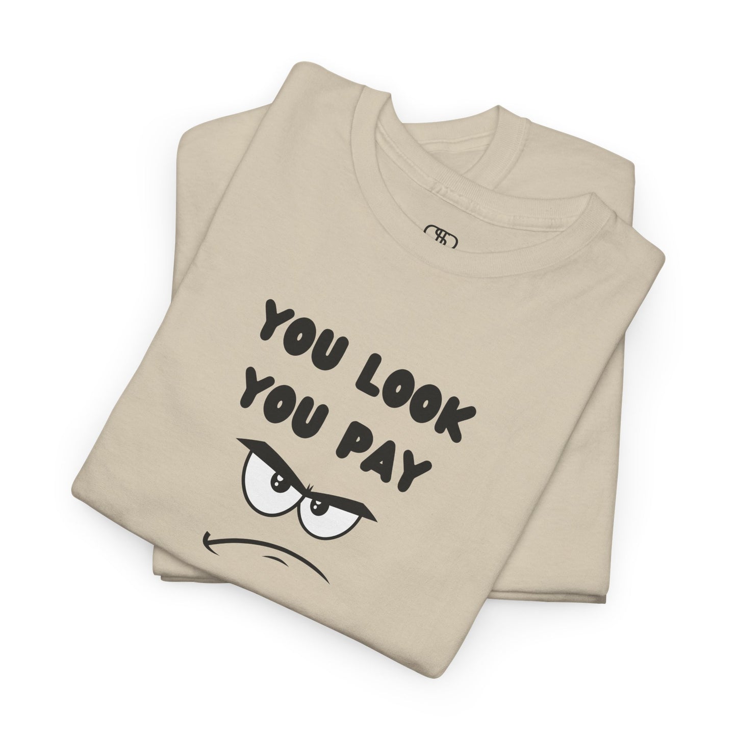 A folded sand  T-shirt with "You Look You Pay" text and an angry cartoon graphic with scrunched eyebrows.