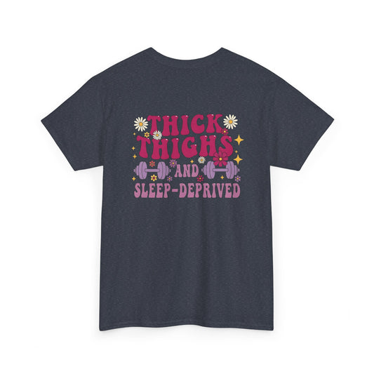 A [heather gray] t-shirt with the phrase "Thick Thighs and Sleep Deprived" in a retro font on the front left and enlarged on the back.