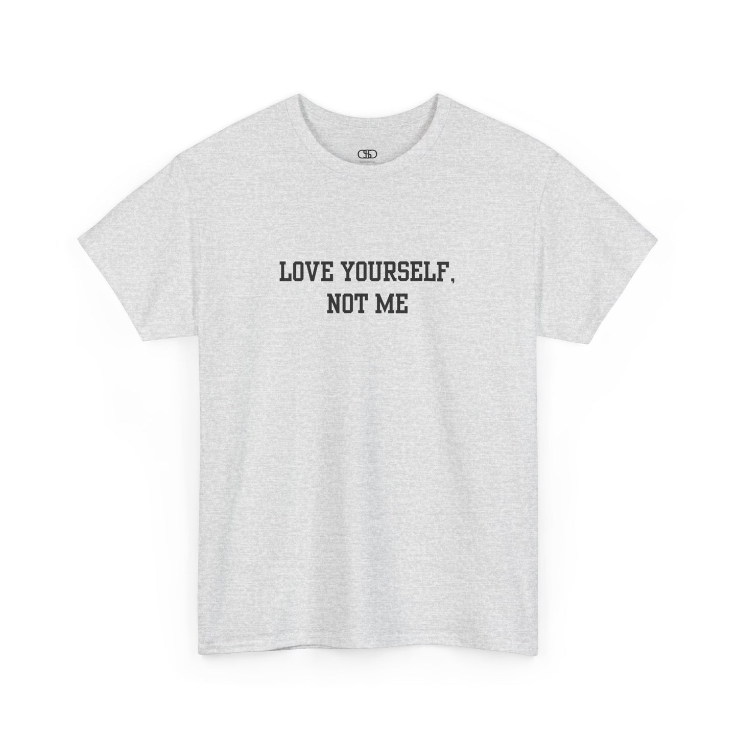 A minimalist ash gray t-shirt with the bold, centered text "Love yourself, not me" in a clean, modern font.