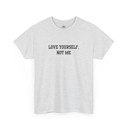 A minimalist ash gray t-shirt with the bold, centered text "Love yourself, not me" in a clean, modern font.