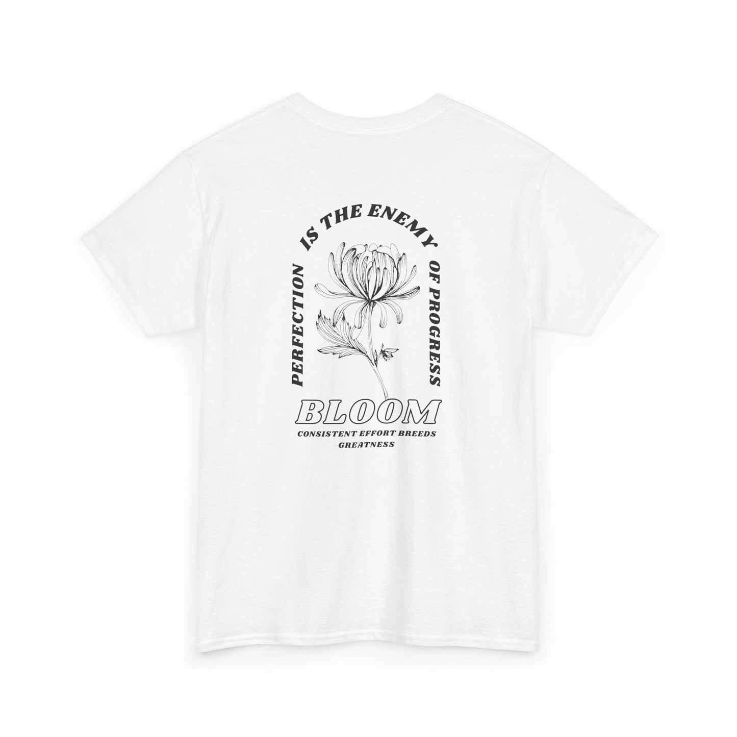 A [white] t-shirt with a central flower design and the words “Perfection is the enemy of progress” and “Bloom” underneath it the phrase "Consistent effort breeds greatness." 