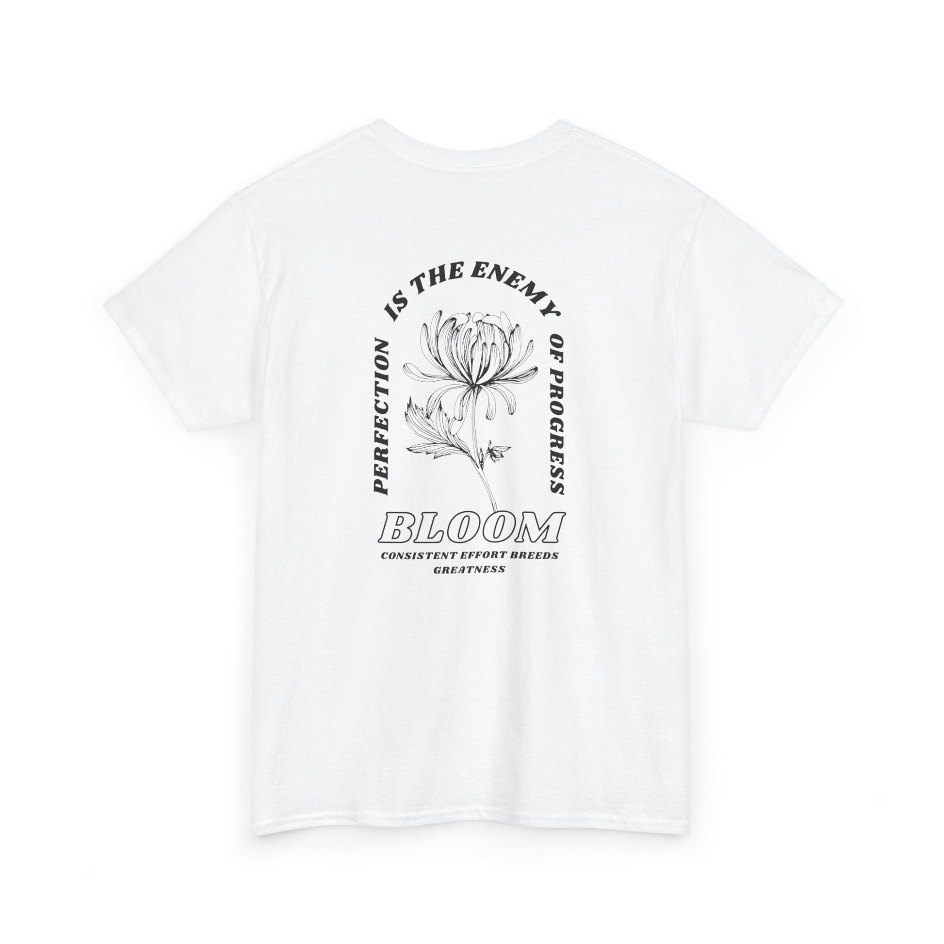 A [white] t-shirt with a central flower design and the words “Perfection is the enemy of progress” and “Bloom” underneath it the phrase "Consistent effort breeds greatness." 