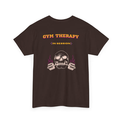 A dark brown t-shirt with a skull lifting a barbell on the front and the words “Gym Therapy In Session” with the same skull on the back.