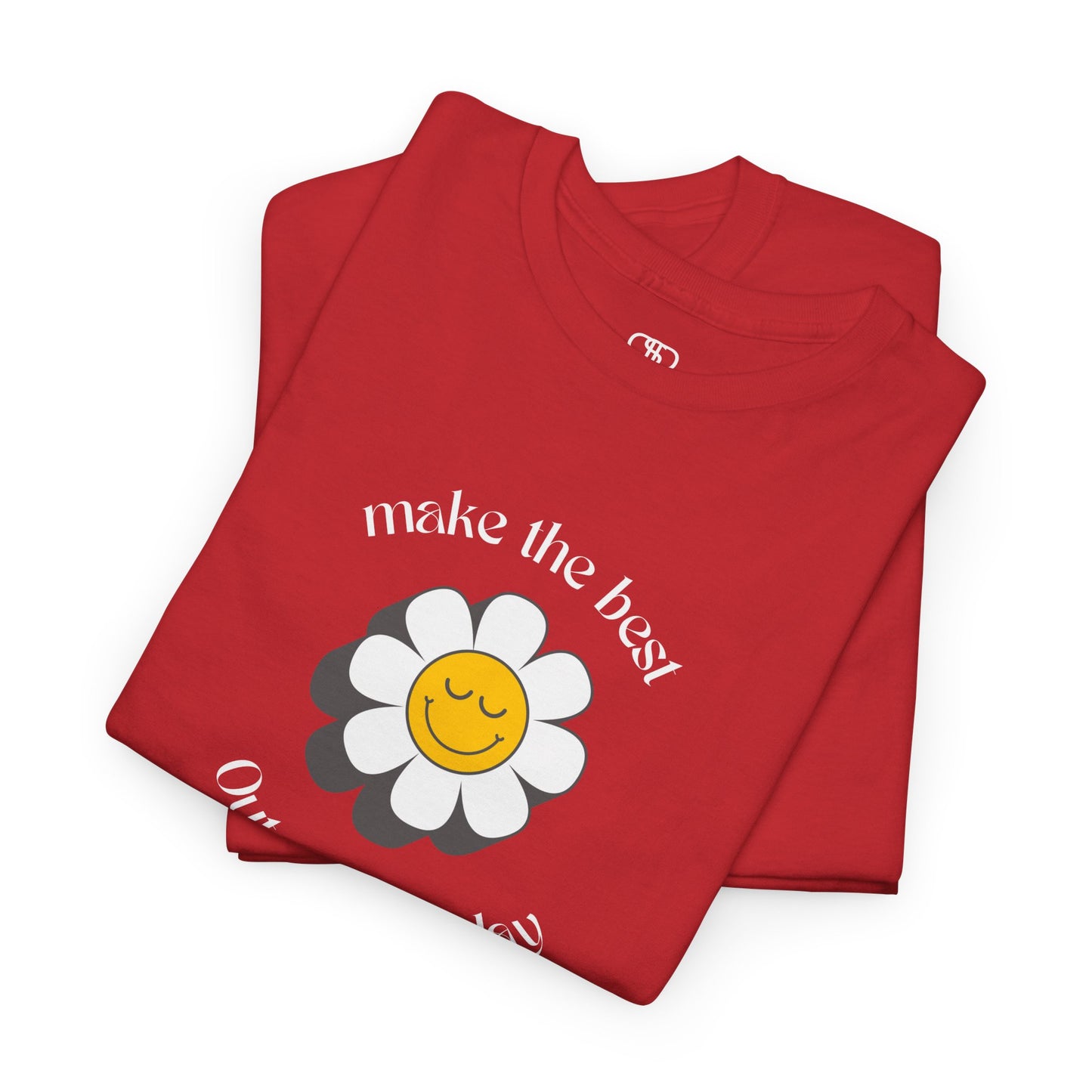 A folded red t-shirt with a smiling sunflower and the words “Make the best out of Everyday” on the front and “Dear Person behind me, I’m glad that you are here” on the back.