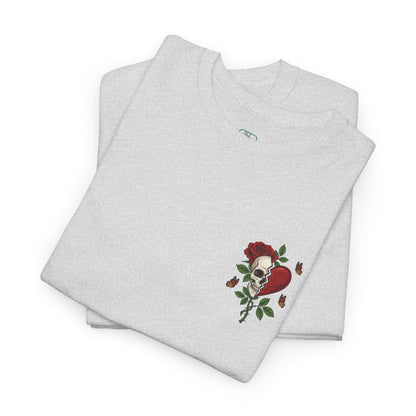 A folded ash gray t-shirt with a front design of a half skull, half broken heart, and a rose. The back reads "Gym Heals" in red.