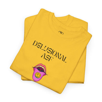 A folded daisy T-shirt with "Delusional asf" text, an open mouth graphic with tongue out, and a happy face emoji pill.