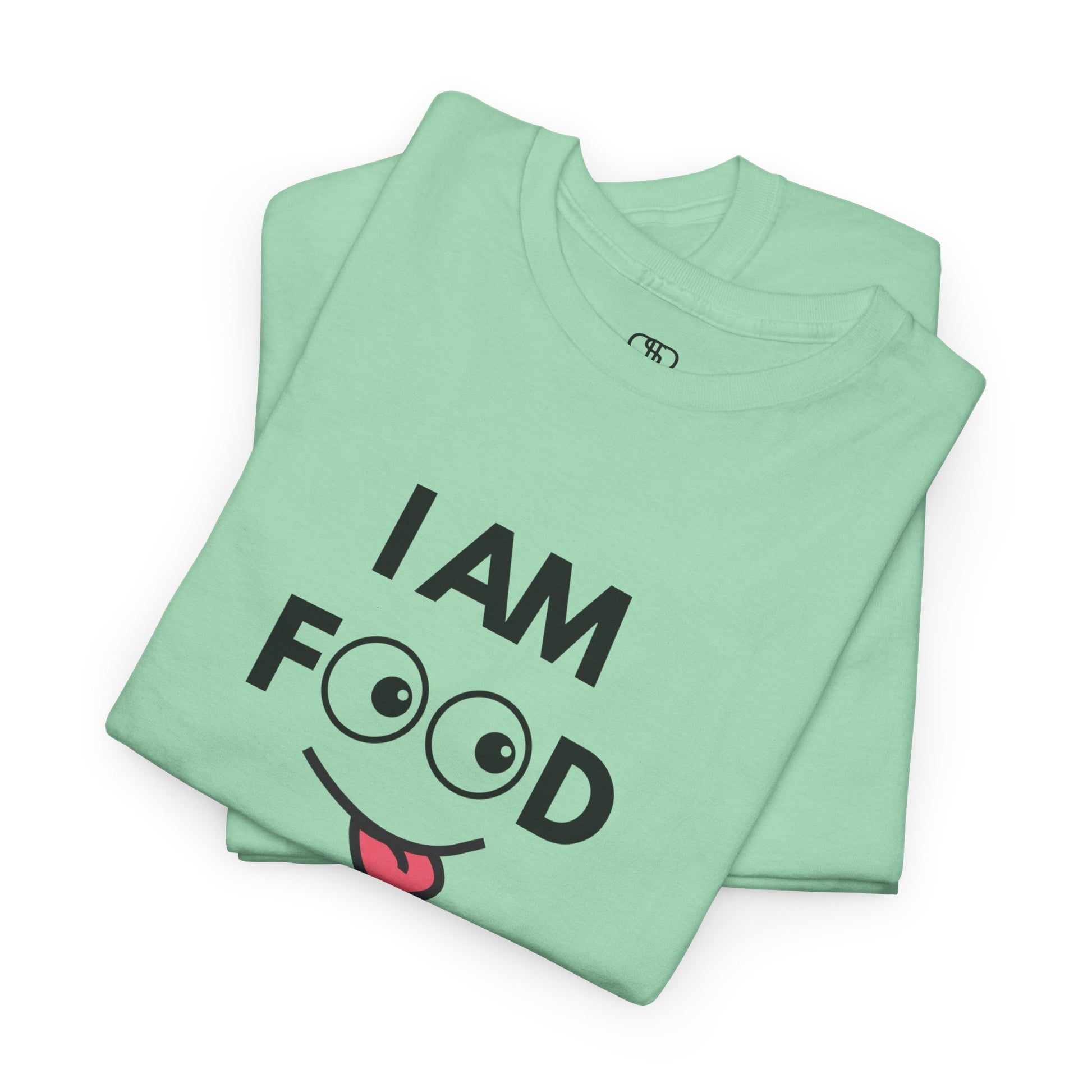 A mint green folded T-shirt with "I AM FOOD" text, where the 'OO' are cartoon eyes, and a tongue-out graphic.