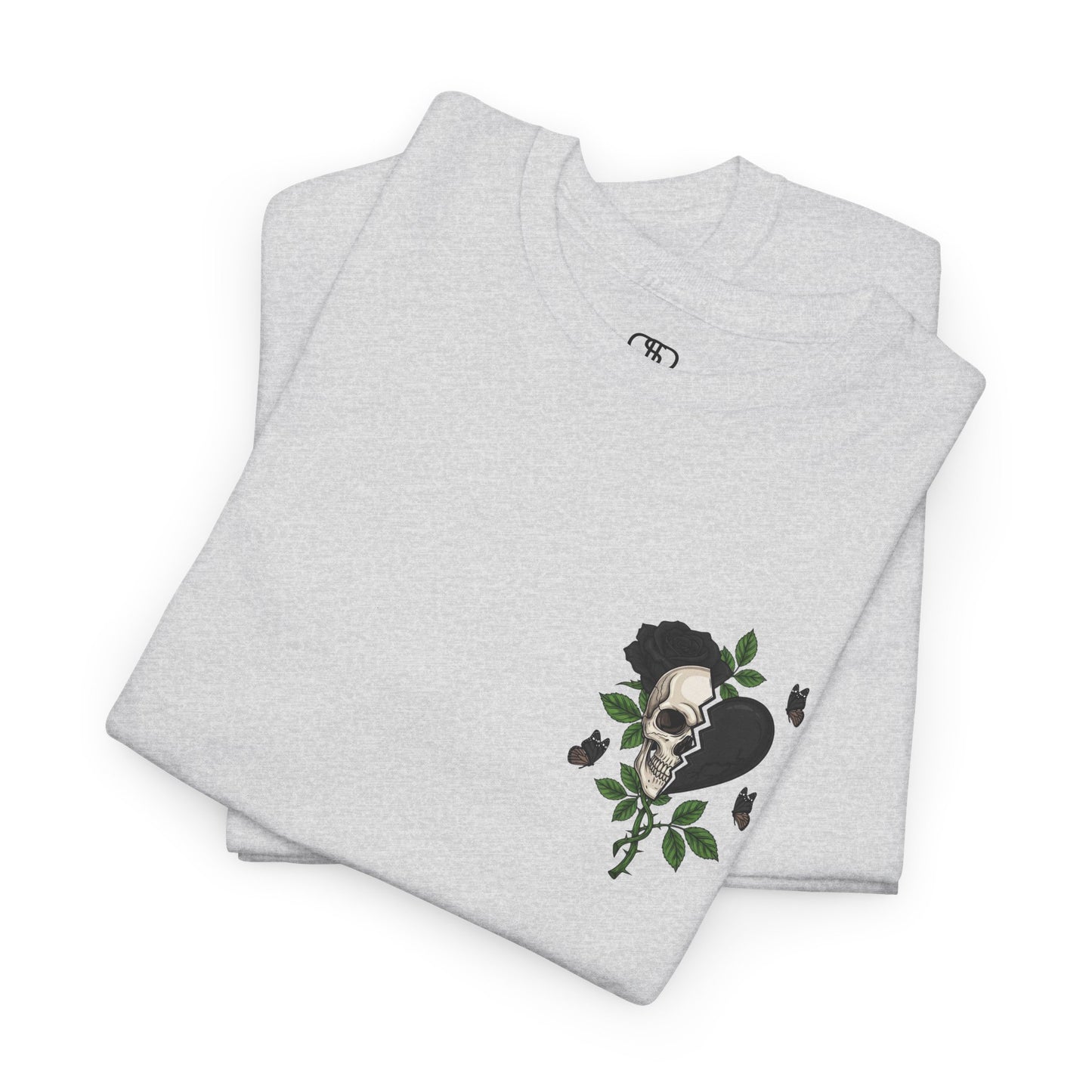 A folded ash gray t-shirt with a front design of a half skull, half broken heart, and a rose. The back reads "Gym Heals" in black.