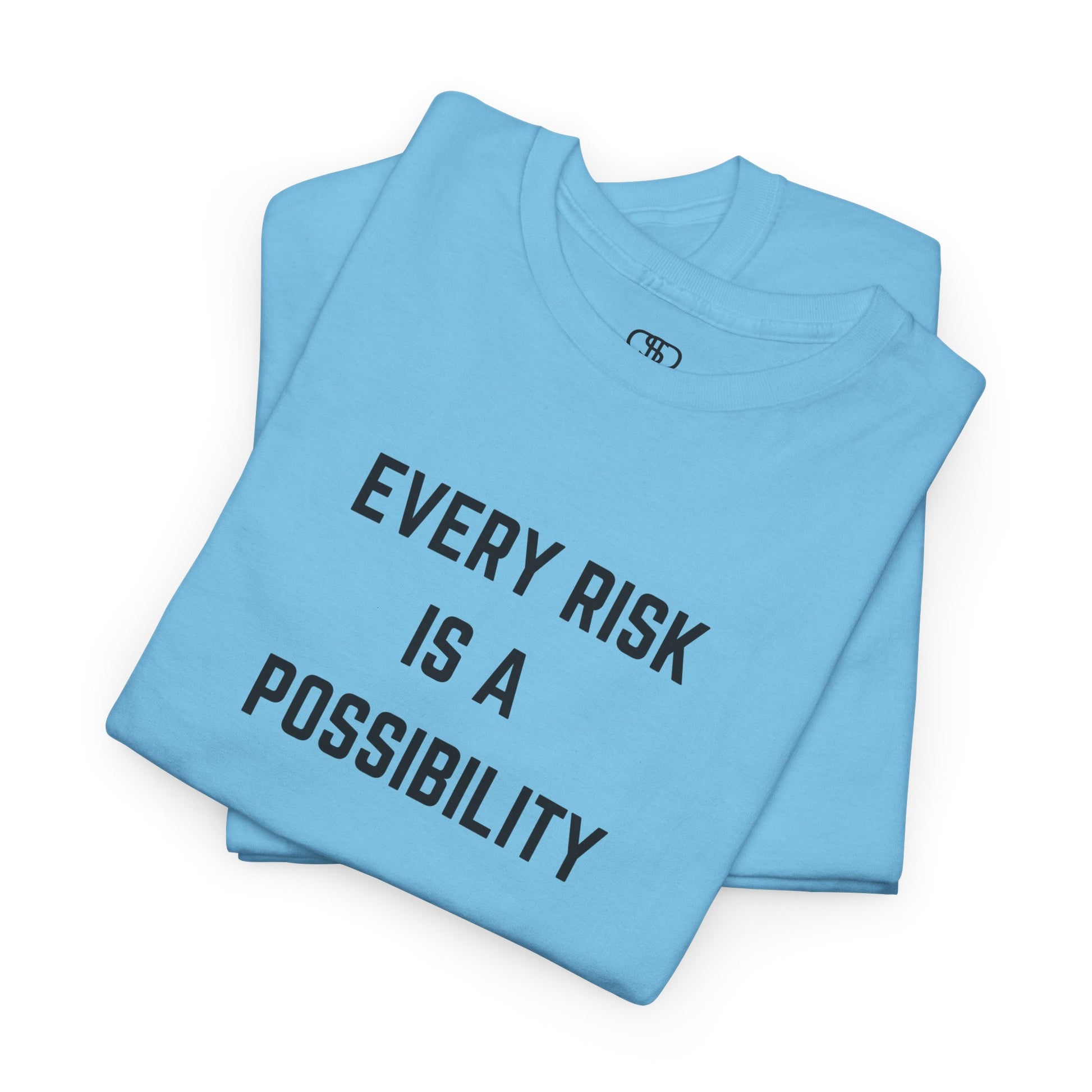  A t-shirt featuring the motivational quote "Every Risk Is a Possibility." in a clean, bold font. 