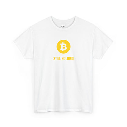 A white  T-shirt with a Bitcoin emblem and "Still Holding" text in gold.