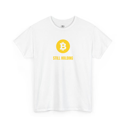 A white  T-shirt with a Bitcoin emblem and "Still Holding" text in gold.