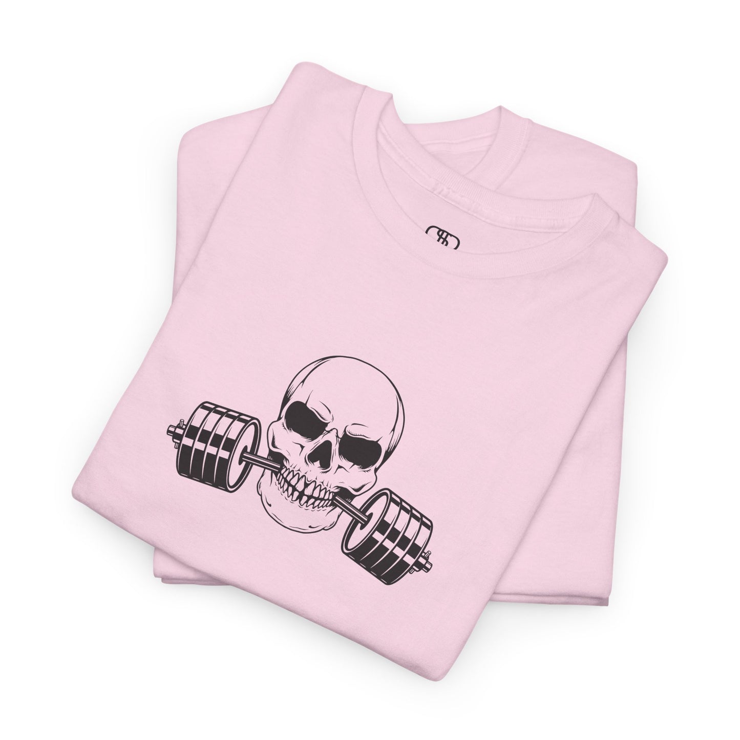 A t-shirt in [light pink color] with a skull biting a barbell and the words “Be Stronger Than Your Excuses.”