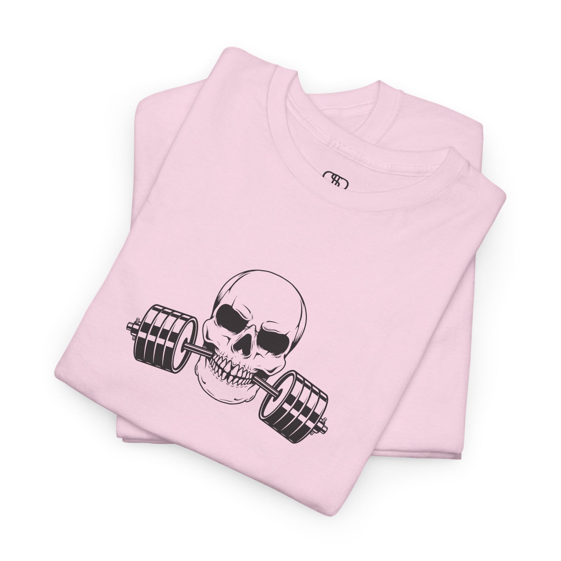 A t-shirt in [light pink color] with a skull biting a barbell and the words “Be Stronger Than Your Excuses.”
