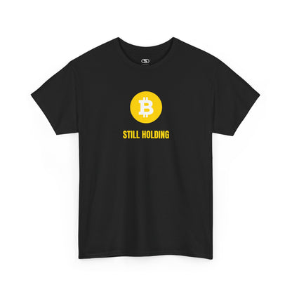 A black  T-shirt with a Bitcoin emblem and "Still Holding" text in gold.
