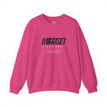 A pink  sweater "Mindset Matters" text with stars on a sweater, inspirational quote below the main quote. 