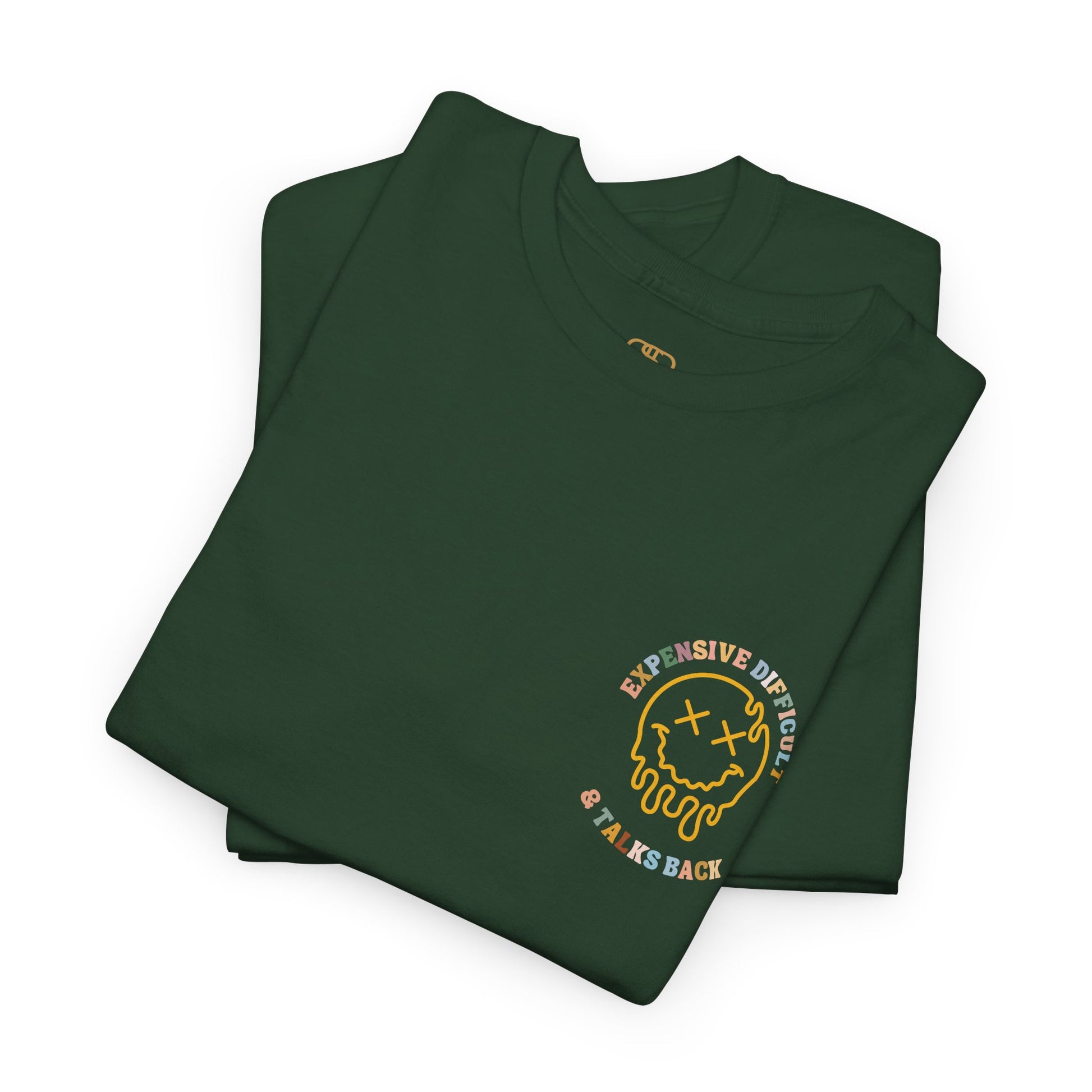 A folded forest green t-shirt with a melting emoji and the words “Expensive Difficult & Talks Back” on the front and the full phrase in a retro wavy font on the back.