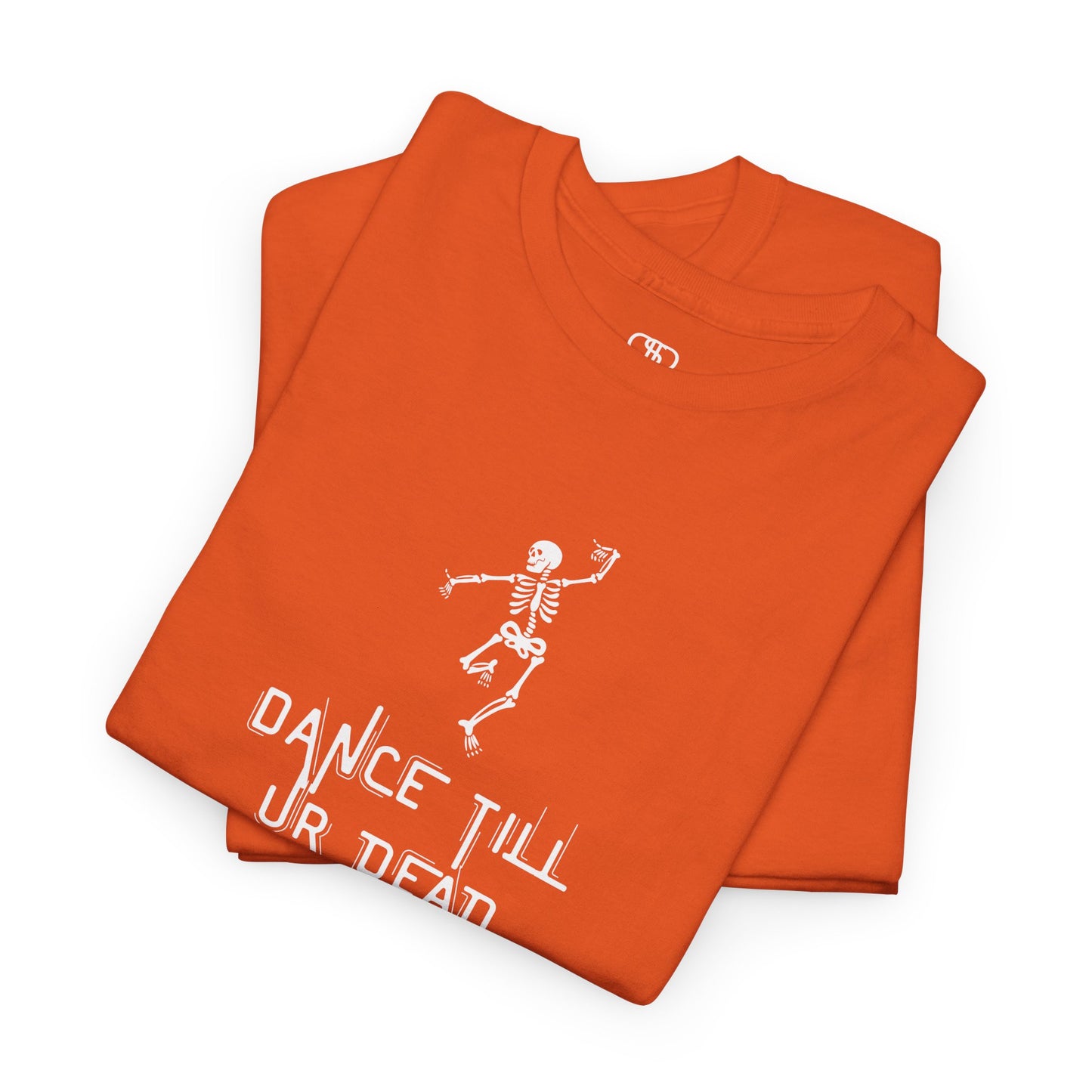 A folded orange T-shirt with a dancing skeleton graphic and "Dance Till Ur Dead" text in a creative font.