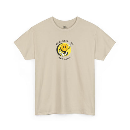 Sand Front of a t-shirt showing a smiling waving emoji with curved text "Remember You Are Alive." The back shows a vibrant, smiling sunflower with the words "Make the Best Out of Everyday."