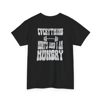  A t-shirt with a smiley face emoji on the front and the phrase “Everything Hurts and I am Hungry” in a retro font on the back.