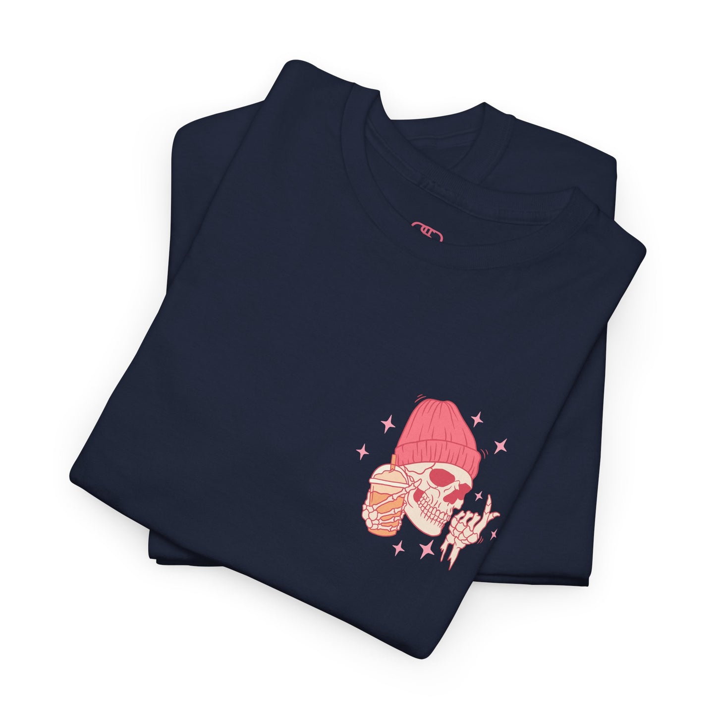 A NAVY FOLDED T-shirt with a skeleton in a pink beanie holding a frozen coffee, snapping fingers, surrounded by sparkles graphic.
