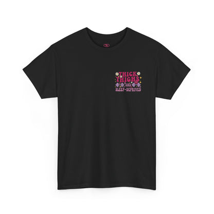A [black] t-shirt with the phrase "Thick Thighs and Sleep Deprived" in a retro font on the front left and enlarged on the back.