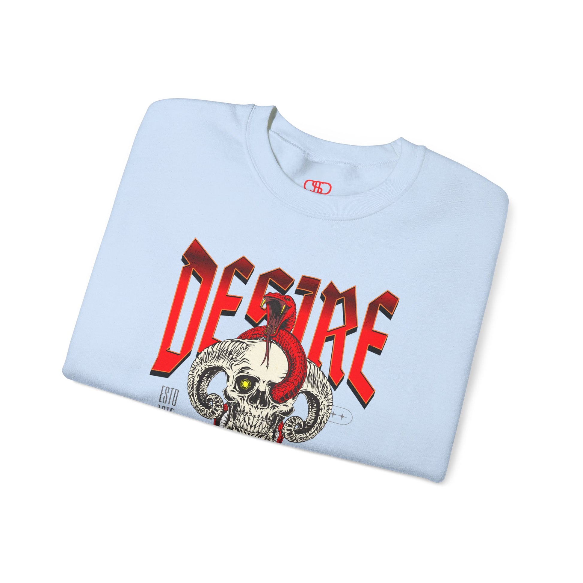 A folded light blue sweatshirt Horned skull with glowing eye and red snake wrapped around it, "Desire Death's Touch" text, gothic sweatshirt design.