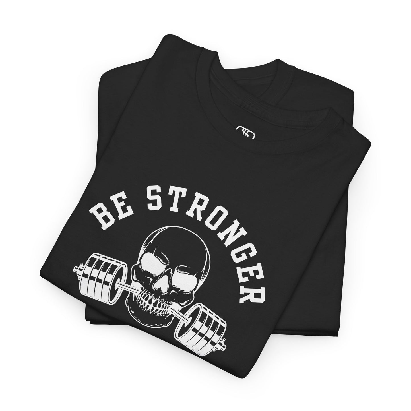  A folded t-shirt in [black] with a skull biting a barbell and the words “Be Stronger Than Your Excuses.”