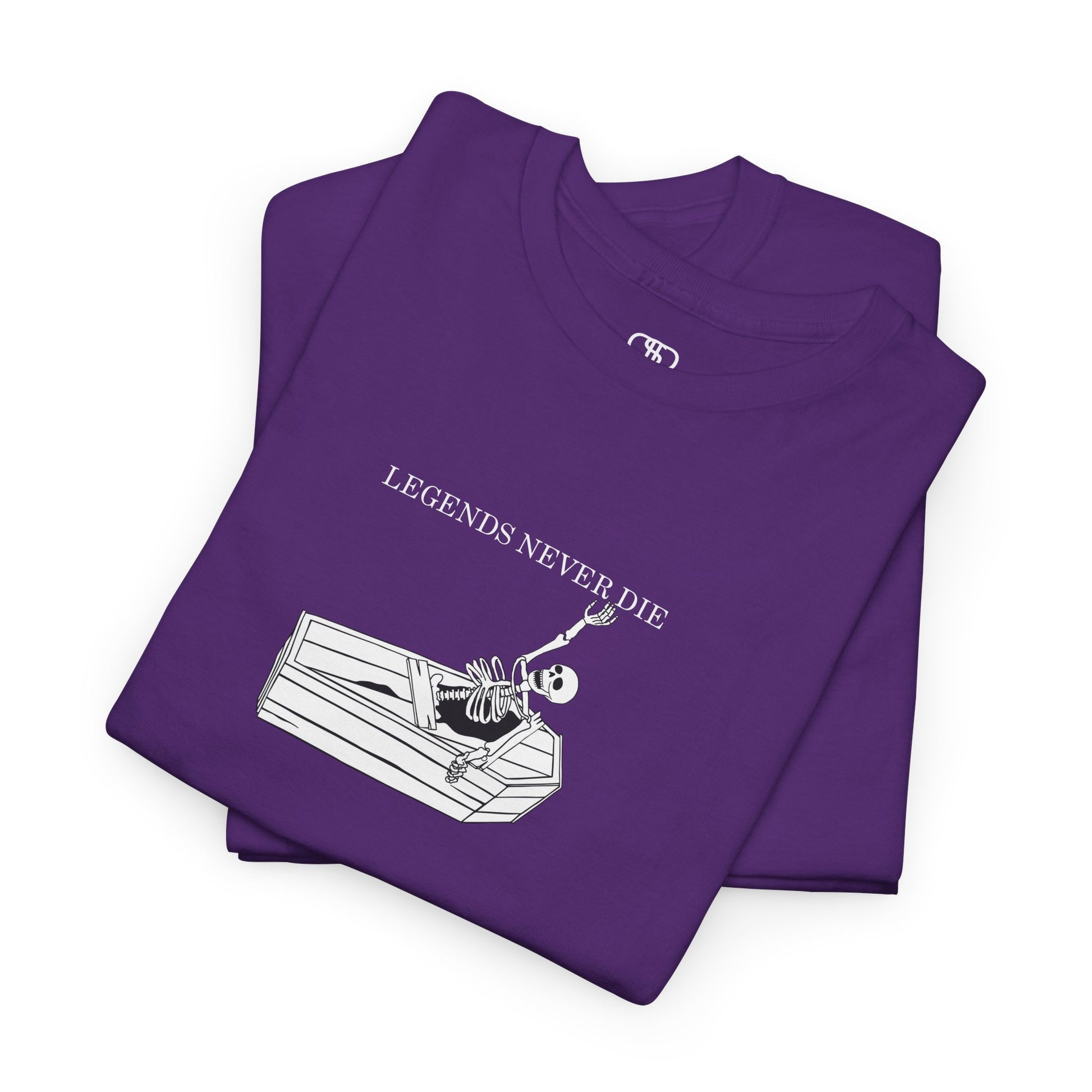A folded purple T-shirt with a skeleton breaking free from a casket, reaching up towards "Legends Never Die" text.