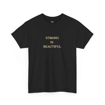 An Art Nouveau style illustration on the back of a black t-shirt, featuring a strong woman with flowing brown hair curling a dumbbell. Below her, the words "Strong is Beautiful" are written in an elegant, stylized font, framed by intricate floral and line work.