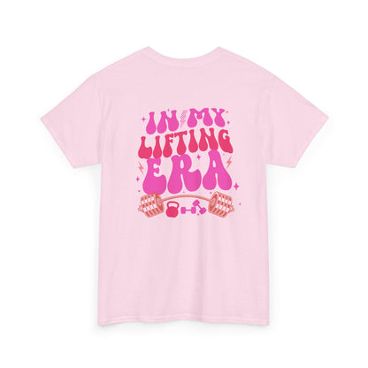 A light pink t-shirt with a retro smiley face on the front and the phrase “In my lifting Era” in a creative retro design on the back.