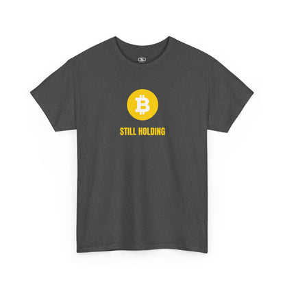 A dark heather  T-shirt with a Bitcoin emblem and "Still Holding" text in gold.