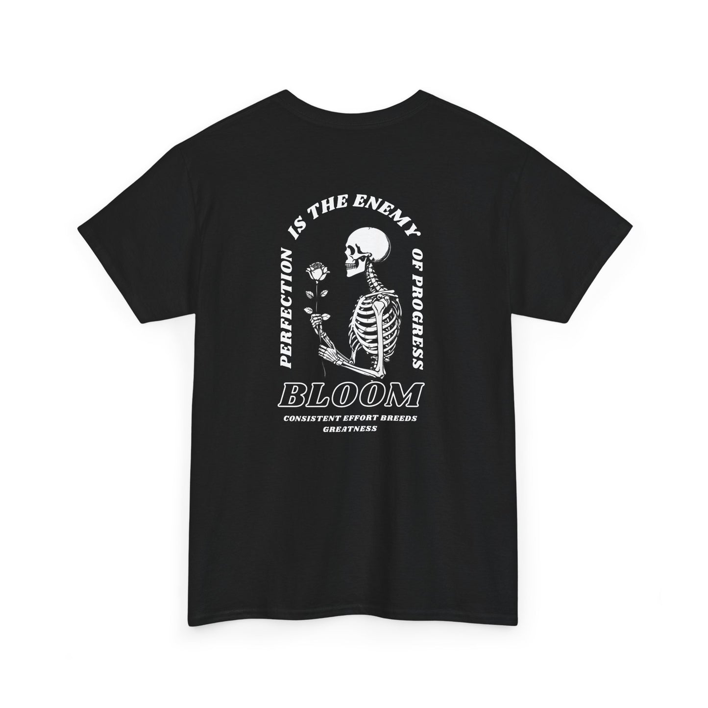 A [black] t-shirt with a central skeleton and rose design and the words “Perfection is the enemy of progress” and “Bloom” on the front.