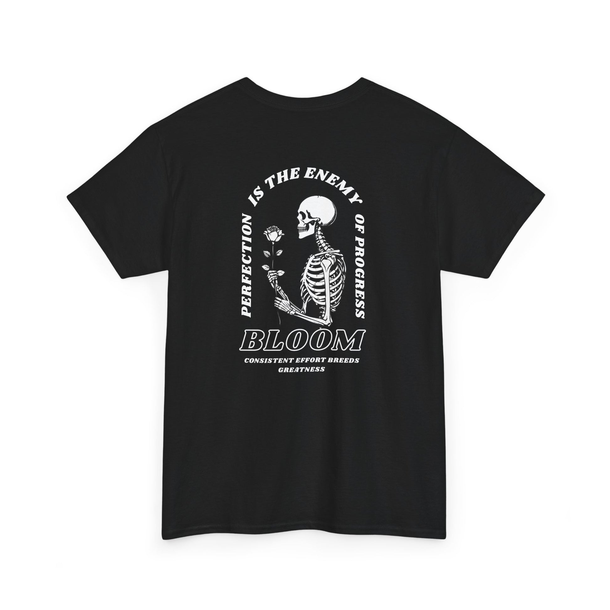 A [black] t-shirt with a central skeleton and rose design and the words “Perfection is the enemy of progress” and “Bloom” on the front.