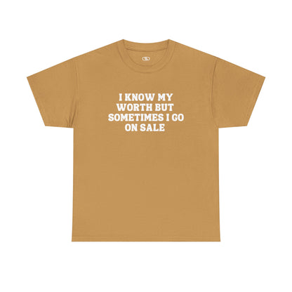 A [gold] t-shirt with the funny quote "I know my worth but sometimes I go on sale" printed in a clean, black font across the chest.