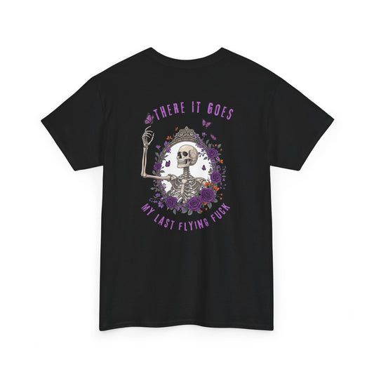 A black t-shirt with a skeleton hand flipping its middle finger on the front surrounded by vines, roses, & butterflies, and a full skeleton design on the back with the phrase “My Last Flying Fuck.”