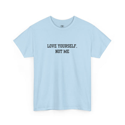 A minimalist light blue t-shirt with the bold, centered text "Love yourself, not me" in a clean, modern font.