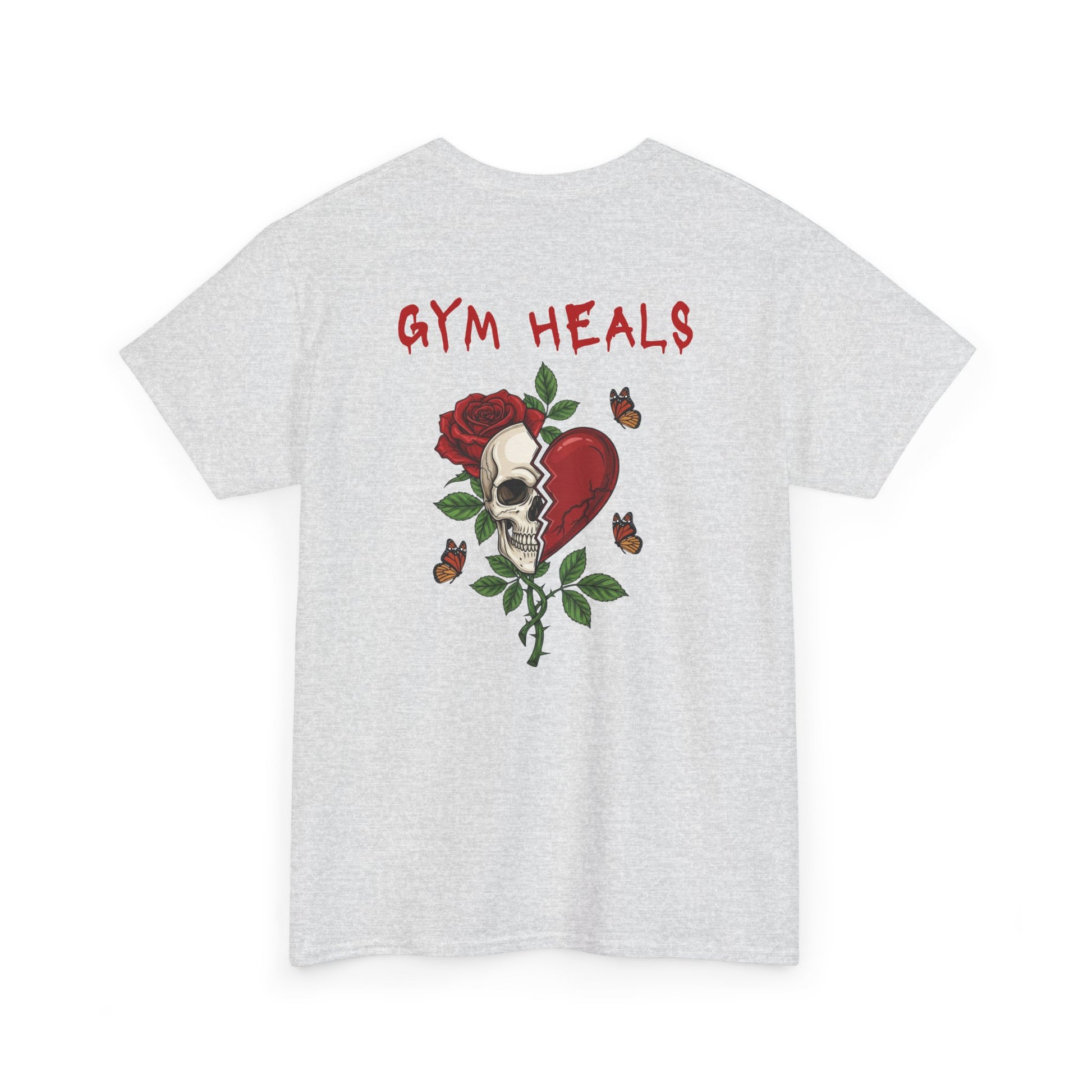 An ash gray t-shirt with a front design of a half skull, half broken heart, and a rose. The back reads "Gym Heals" in red.