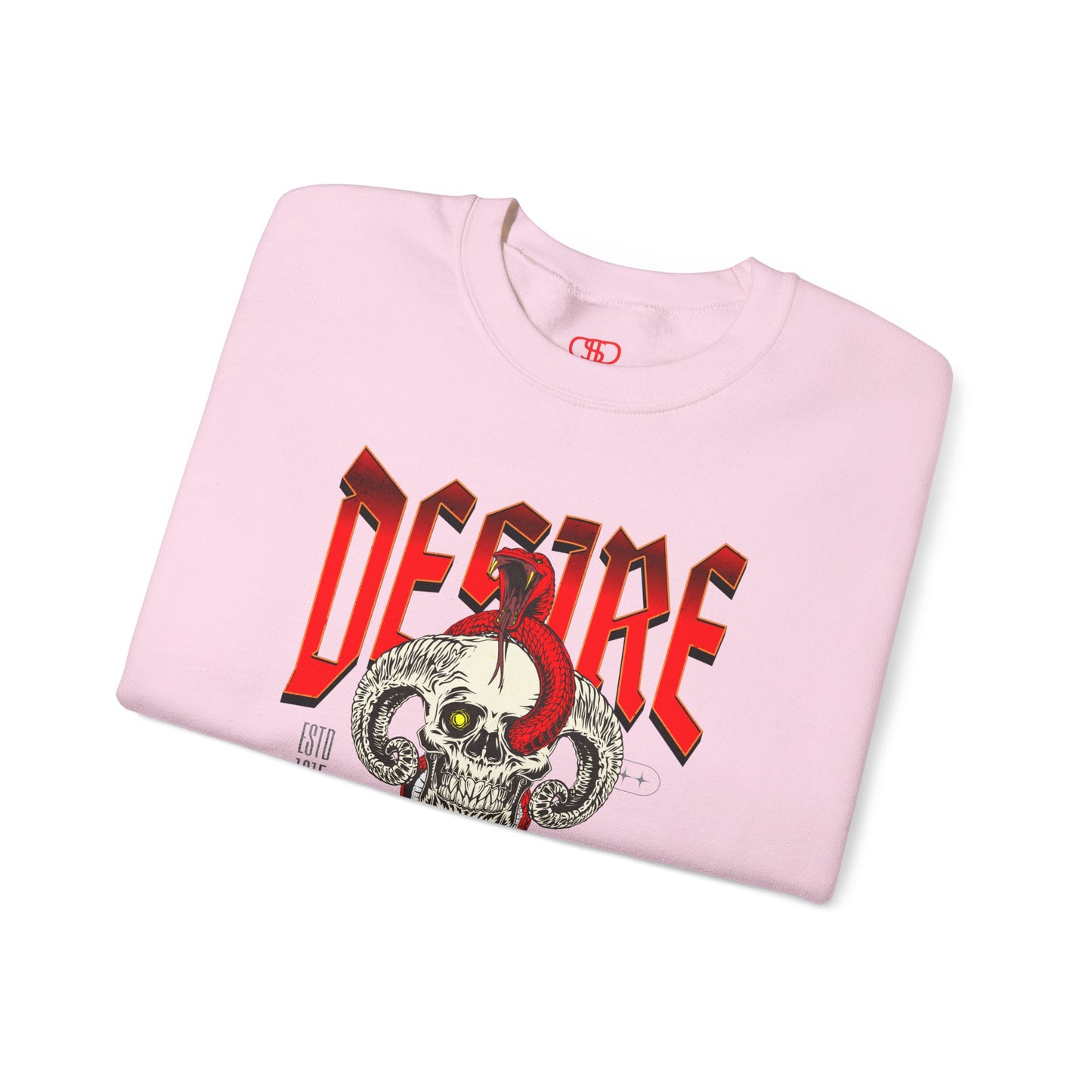 A folded light pink sweatshirt Horned skull with glowing eye and red snake wrapped around it, "Desire Death's Touch" text, gothic sweatshirt design.