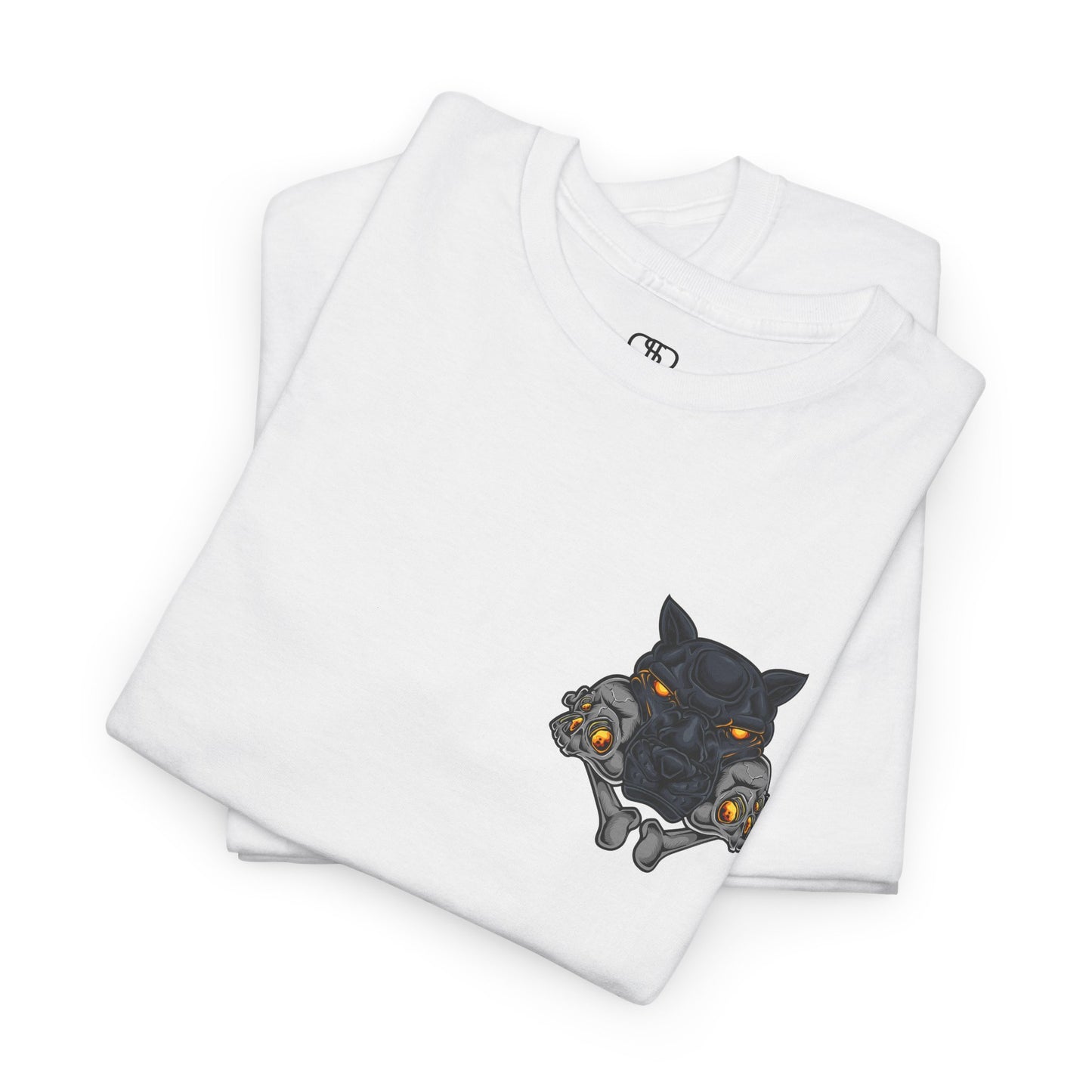A folded White T-shirt with a daring dog graphic biting two skulls, all with glowing molten lava-like eyes.