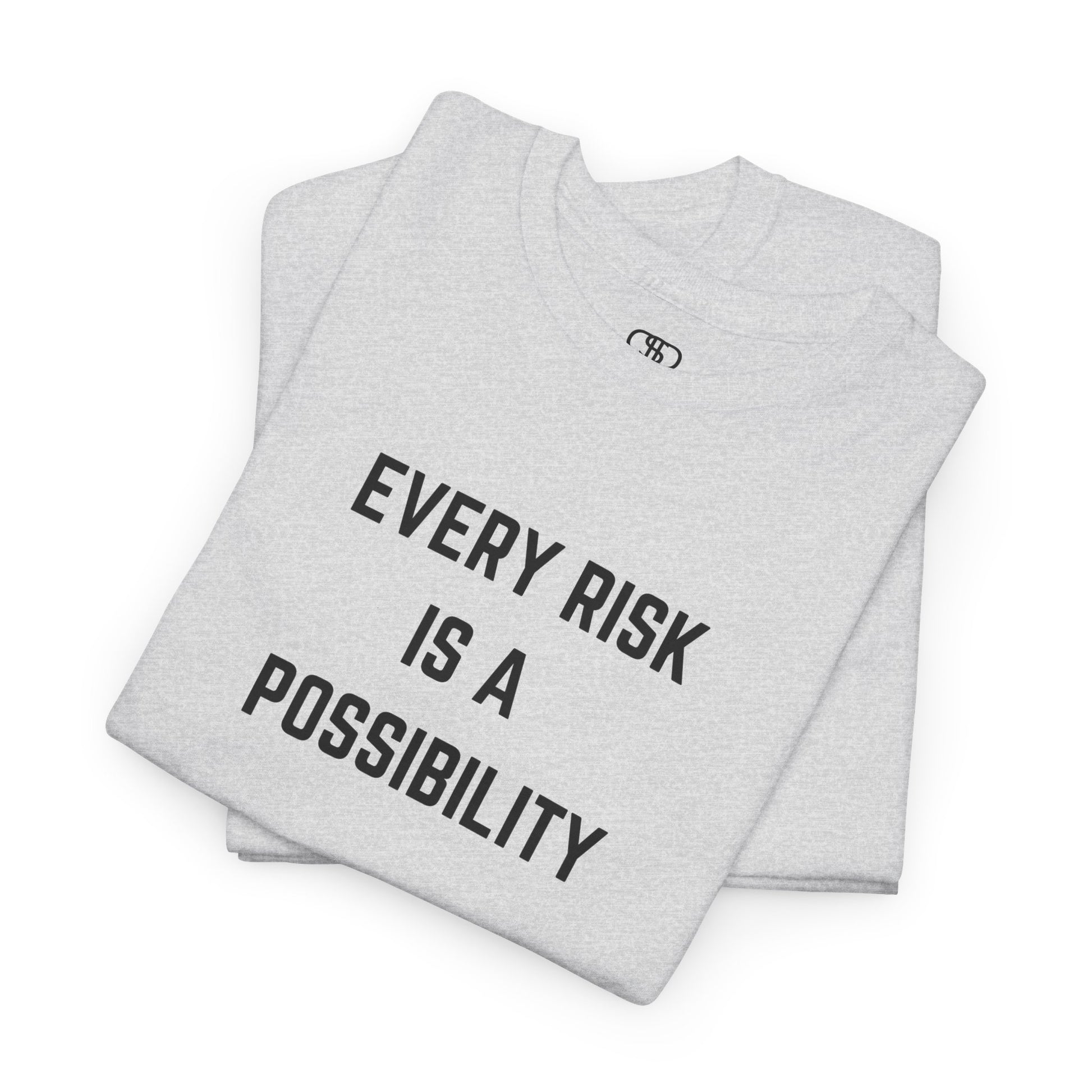 Folded  t-shirt featuring the motivational quote "Every Risk Is a Possibility." in a clean, bold font.