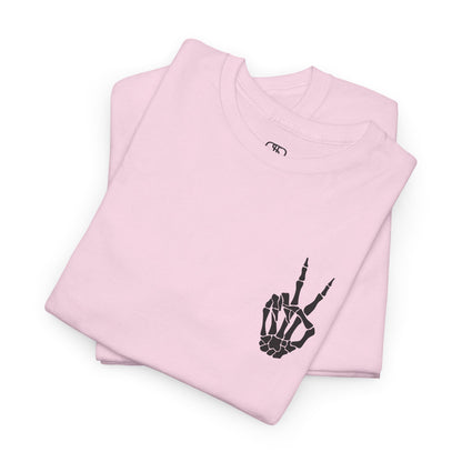 A [folded light pink] t-shirt with a skeletal peace sign on the front and the phrase “Have the day you deserve” with a large skeletal peace sign on the back.