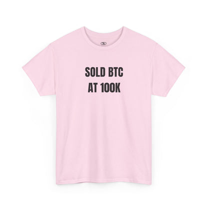 A LIGHT Pink T-shirt with bold text "SOLD BTC At 100K" on the front.