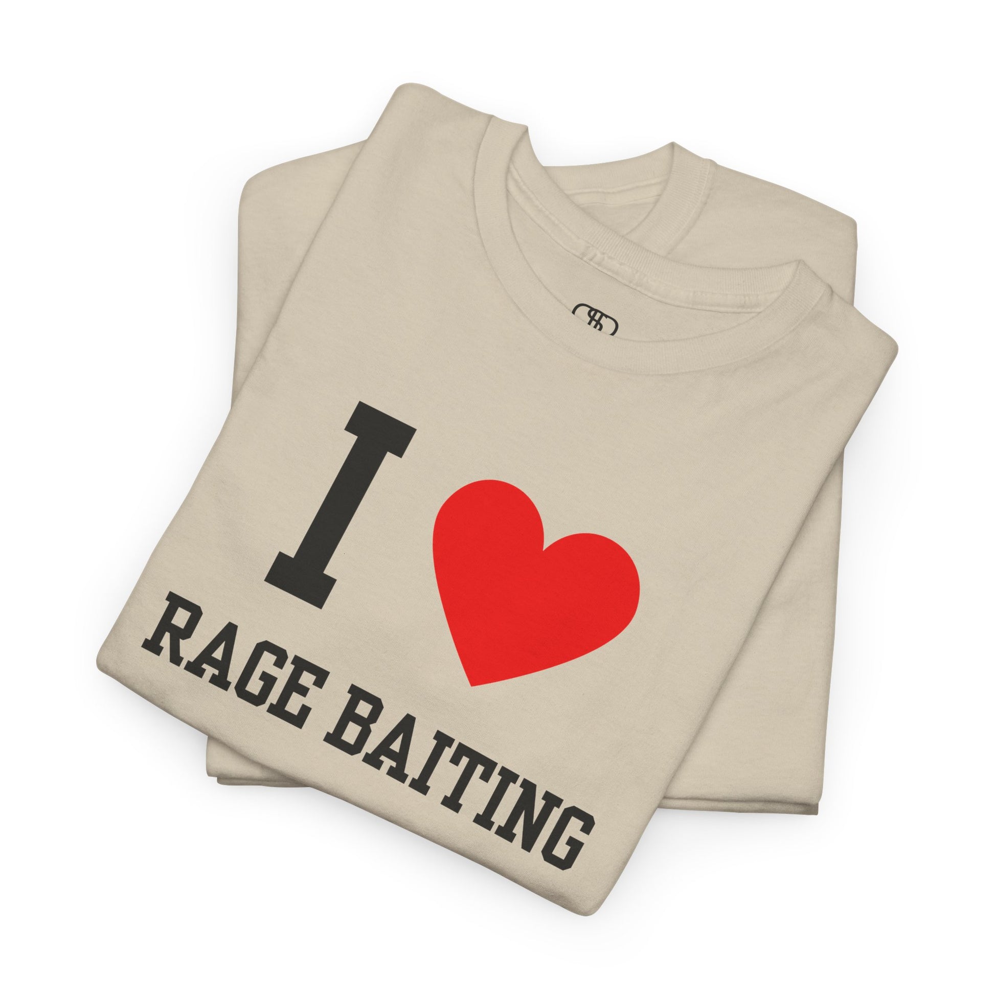 A folded sand t-shirt featuring the classic "I Love" graphic style with the text "I," a red heart, and the words "Rage Baiting" below it.