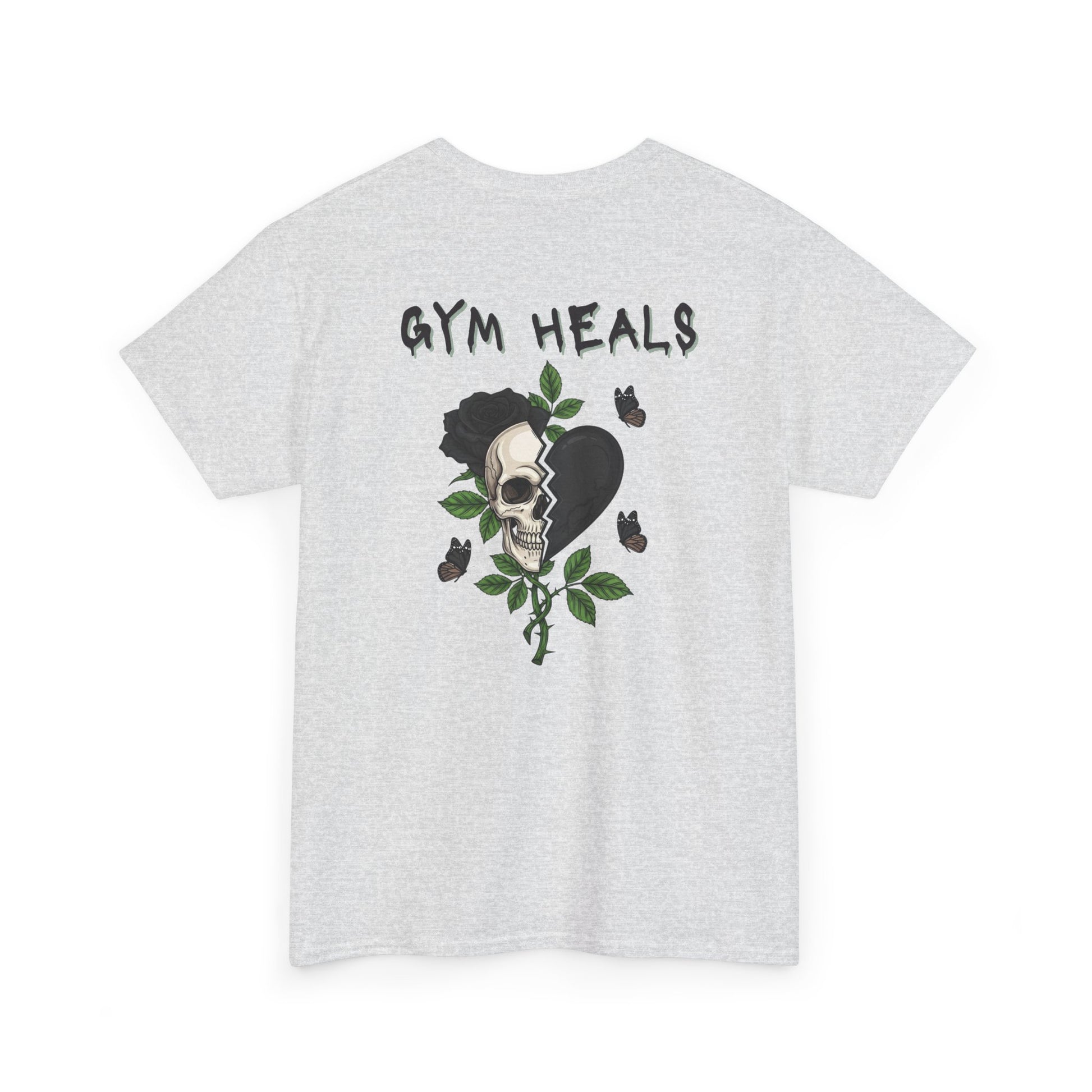 An ash gray t-shirt with a front design of a half skull, half broken heart, and a rose. The back reads "Gym Heals" in black.