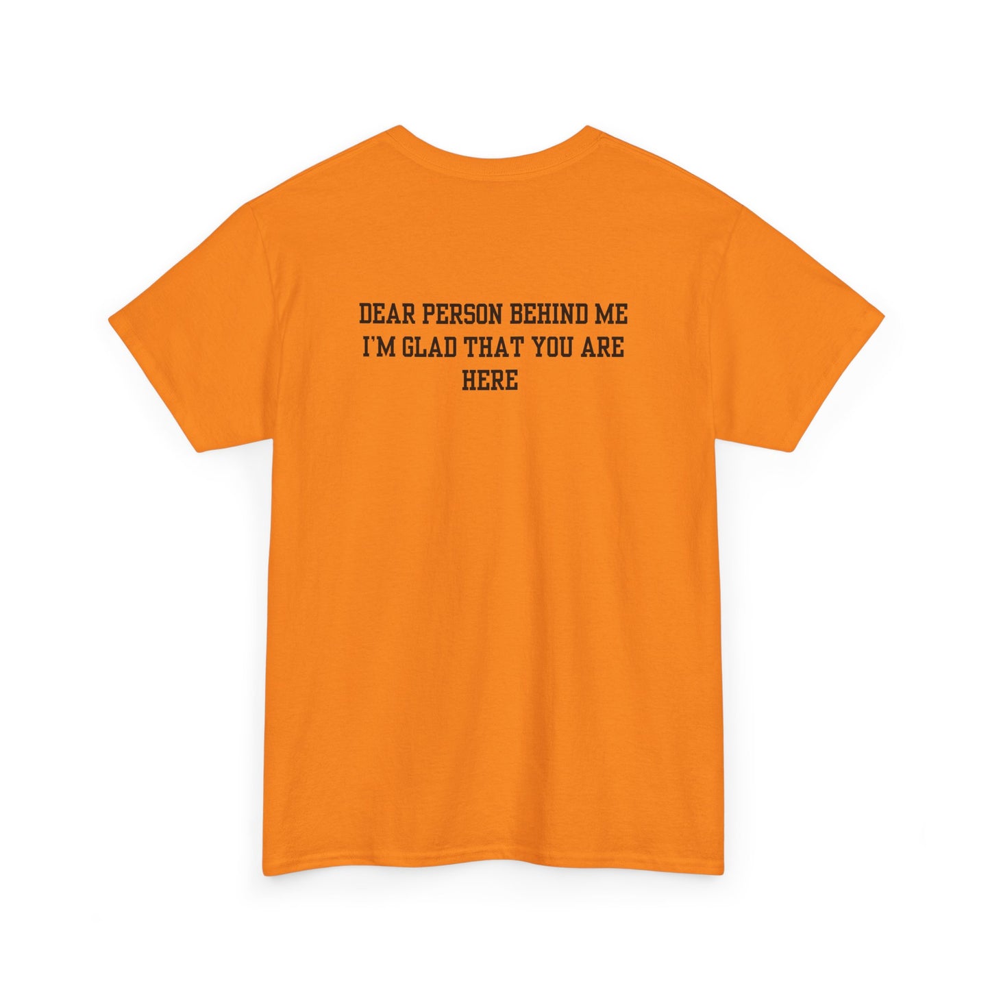 A folded orange t-shirt with a smiling sunflower and the words “Make the best out of Everyday” on the front and “Dear Person behind me, I’m glad that you are here” on the back.