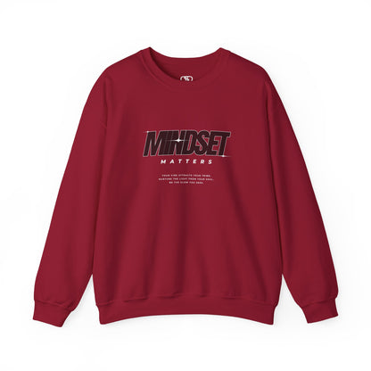 A garnet red sweater "Mindset Matters" text with stars on a sweater, inspirational quote below the main quote. 