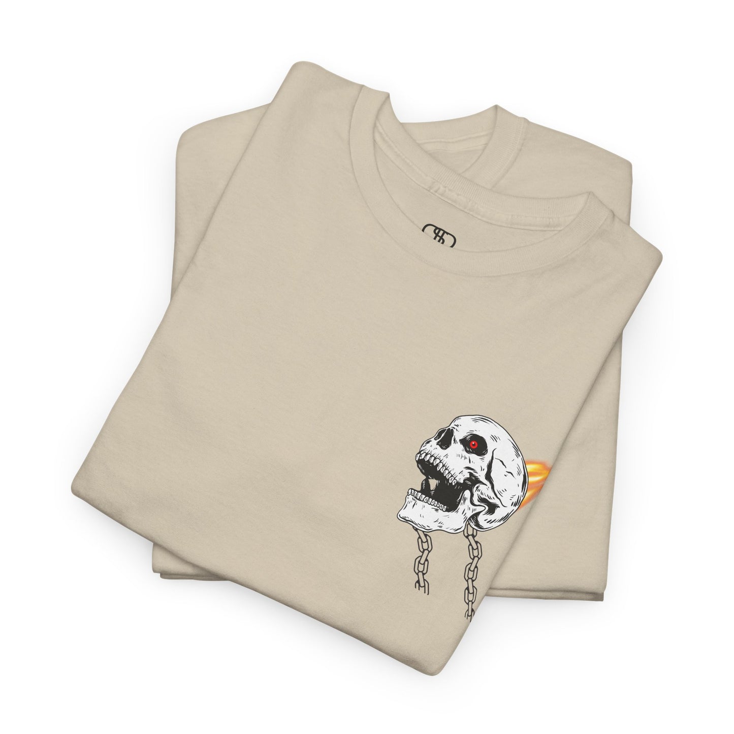 A folded sand T-shirt with a daring skeleton graphic, red glowing eye, chains forming wings, and a flame background