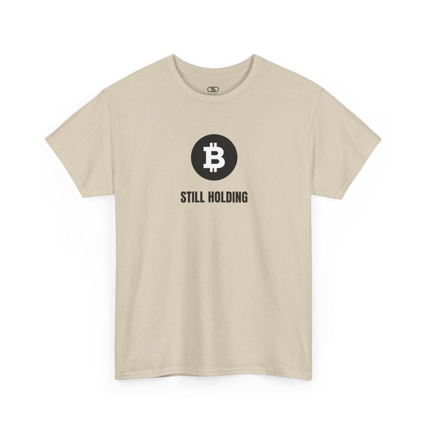 A sand T-shirt with a Bitcoin emblem and "Still Holding" text in black.